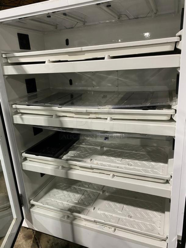 Urban Cultivator Commercial 001 indoor garden with double glass doors, four trays, 120V electric, on casters, white.