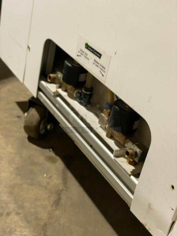 Urban Cultivator Commercial 001, white, double glass door, electric indoor garden on casters. Visible plumbing and label.