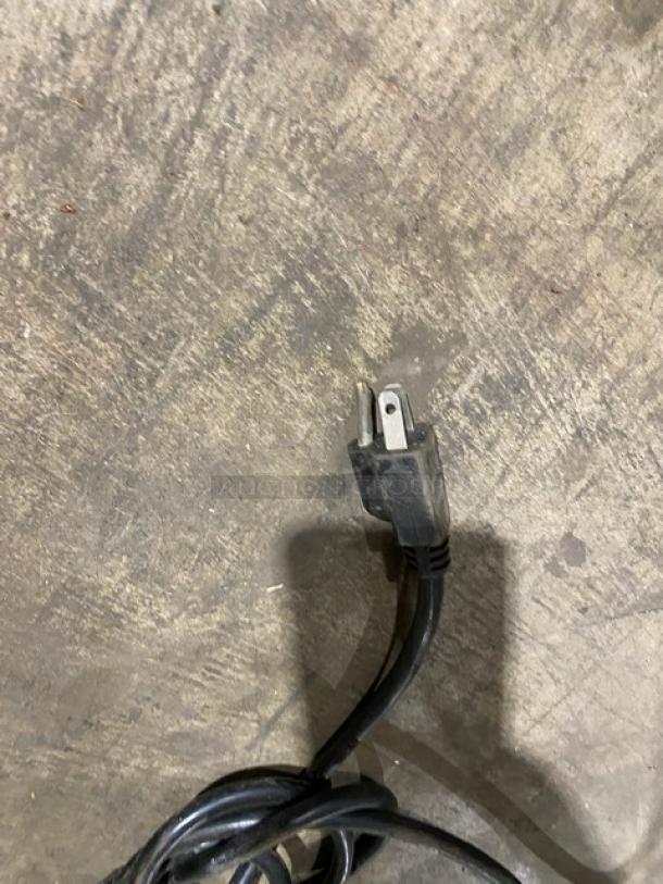 Power cord on floor, attached to Urban Cultivator Commercial Indoor Garden, Model Commercial001, for herbs and vegetables.