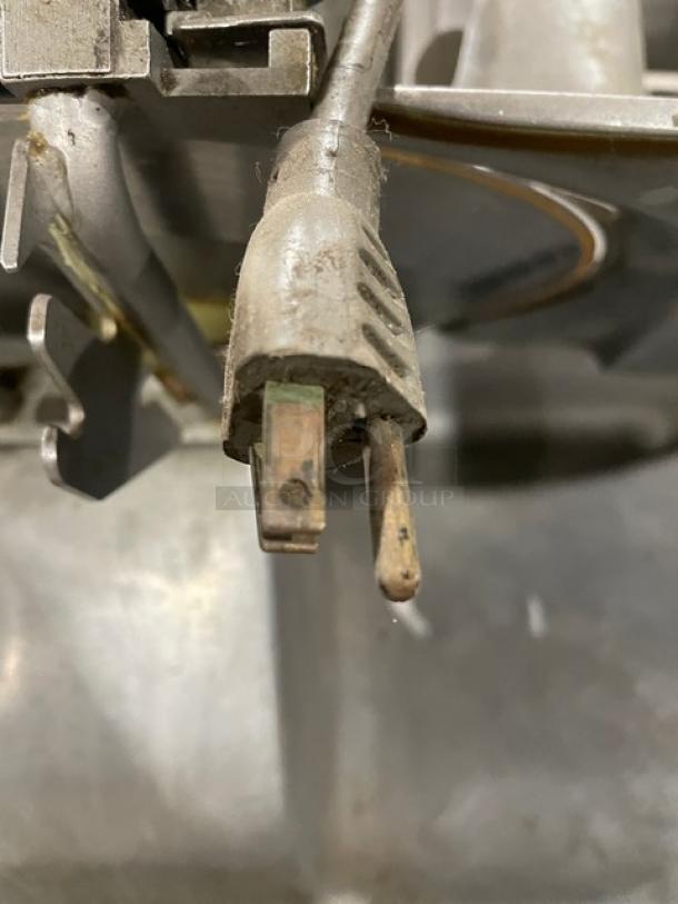 Hobart Model 1612E commercial meat slicer, electric-powered, SN: 561-000-096, 115V, 1 phase, shows wear on plug.