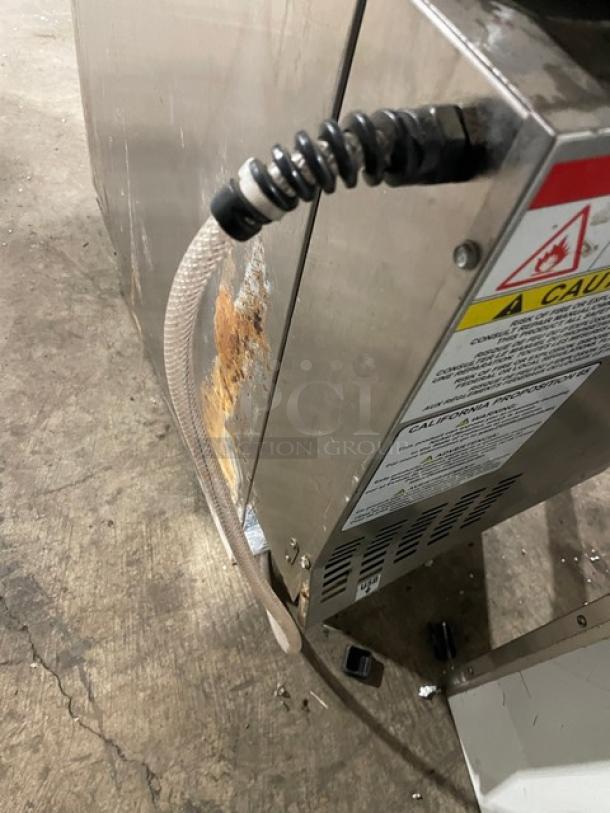 JoeTap 2019 stainless steel electric nitro coffee dispenser with dual taps, model JT-NITCOM-R, 115V, showing wear.