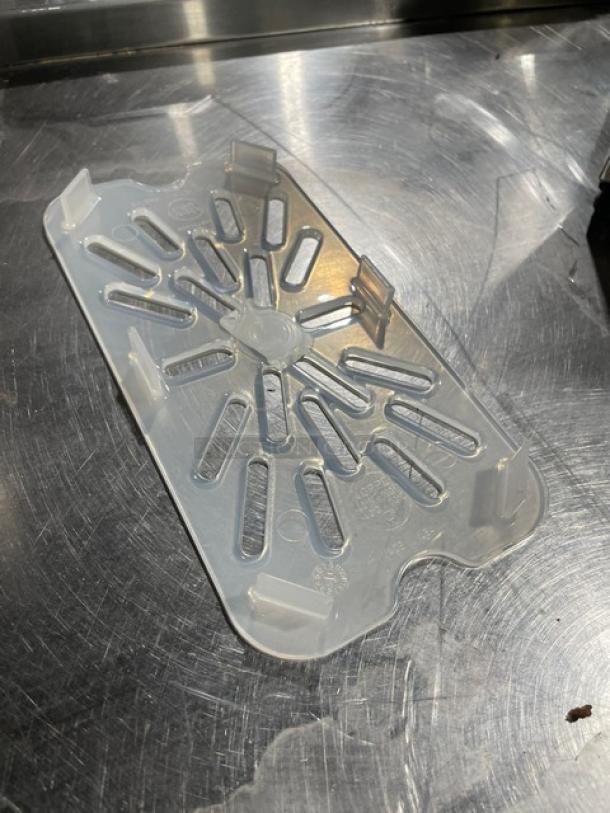 Cambro translucent polypropylene 1/4-size food pan drain shelf, model 40PPD190, scratch resistant, new condition.