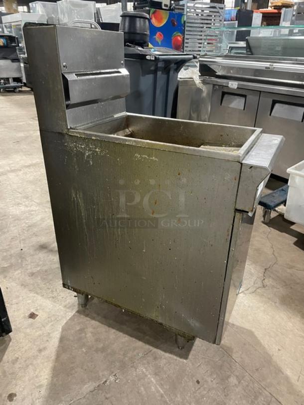 DCS commercial stainless steel gas fryer with backsplash, basket hanger, and legs. Visible wear, ideal for high-volume kitchens.