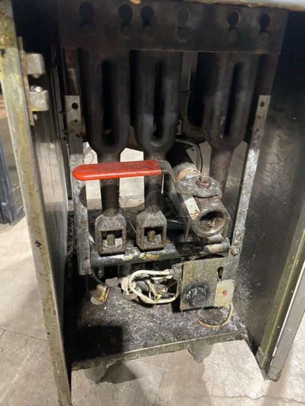 DCS commercial stainless steel gas deep fat fryer, with back splash, basket hanger, on legs. Well-used condition.