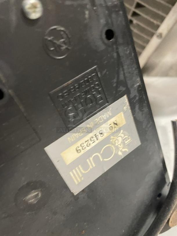 Cunill commercial countertop espresso grinder, SN: 845239, shown with manufacturing label indicating "Made in Spain."