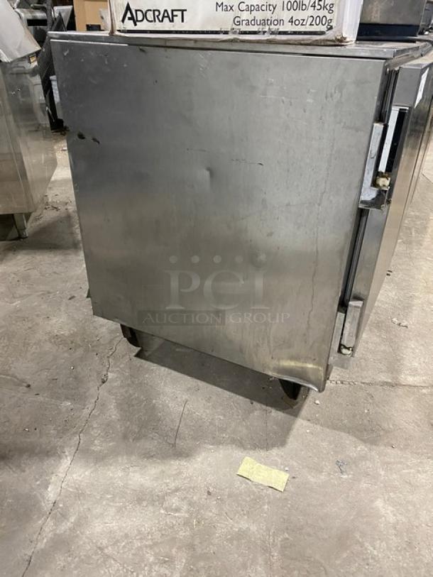 Beverage-Air UCR72A 3-door stainless steel undercounter refrigerator, 72", on casters, visible wear, poly-coated wire rack included.