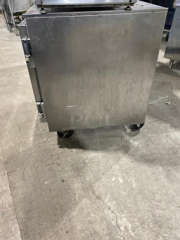 Beverage-Air UCR72A 72" undercounter refrigerator, stainless steel, three doors, poly coated wired rack, on casters.