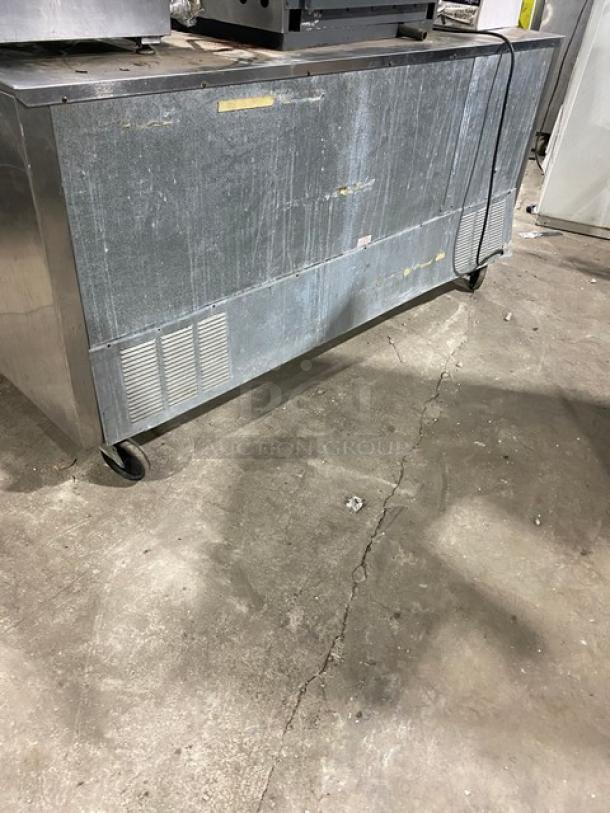 Beverage-Air UCR72A 72" stainless steel undercounter refrigerator, three-door, poly-coated racks, on casters, 115V, used.