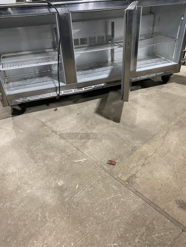 Beverage-Air UCR72A commercial stainless steel 3-door undercounter refrigerator on casters, with poly coated wired rack.