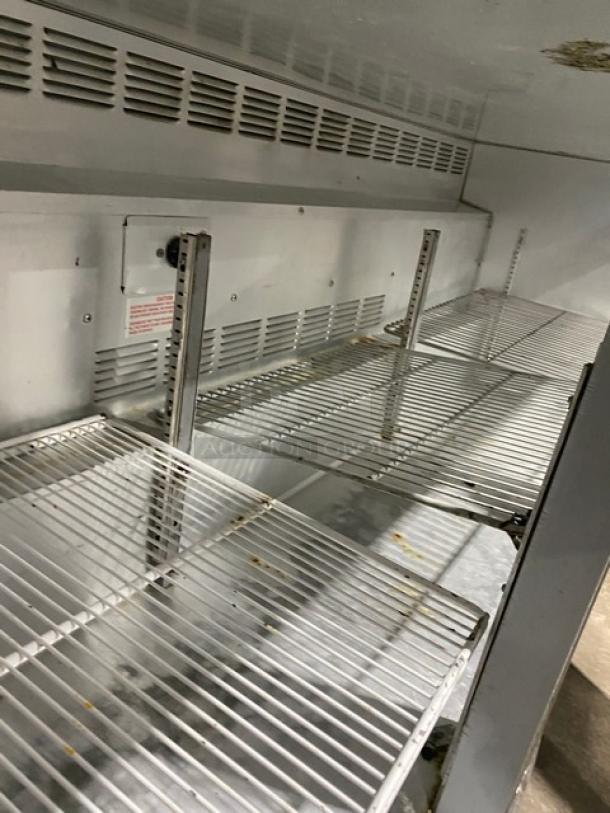 Beverage-Air UCR72A stainless steel undercounter refrigerator interior with poly-coated wire racks, on casters.