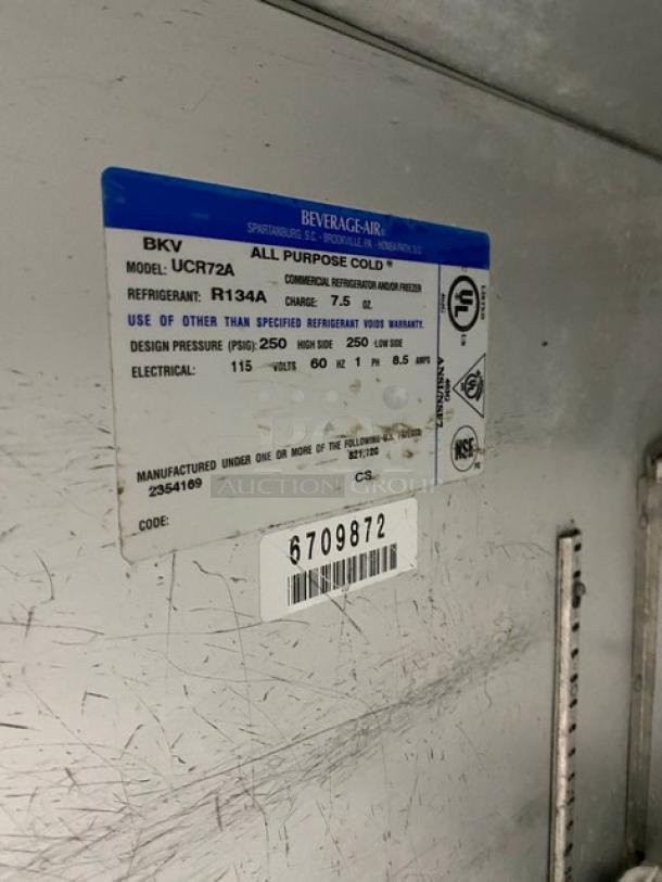 Beverage-Air UCR72A 72" stainless 3-door undercounter fridge, includes poly-coated rack. Serial: 6709872. On casters. 115V.