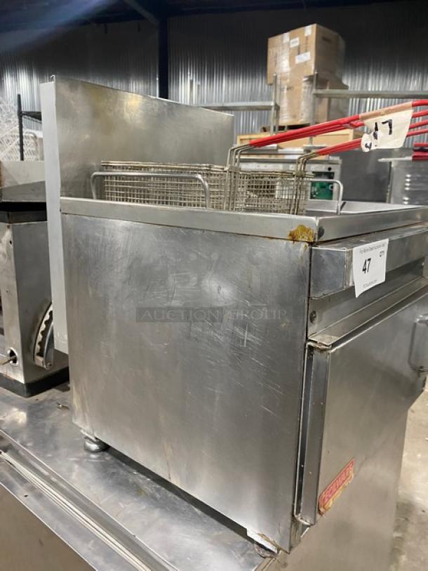 Cecilware commercial stainless steel 28 lb. natural gas countertop deep fat fryer with back splash, frying basket, and legs. Minor surface wear. SN: 054821.
