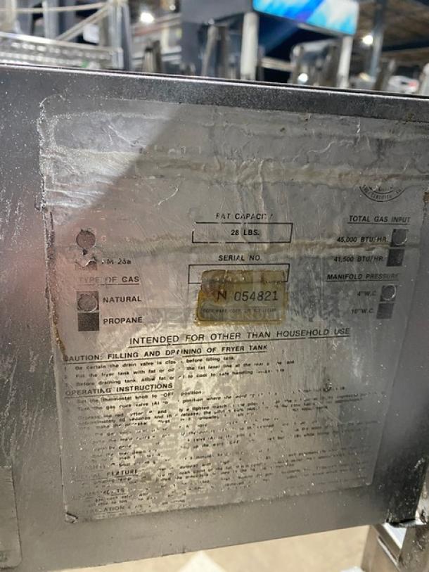 Cecilware commercial stainless steel gas fryer, 28 lb capacity, with backsplash, frying basket, and legs. Serial No. 054821.