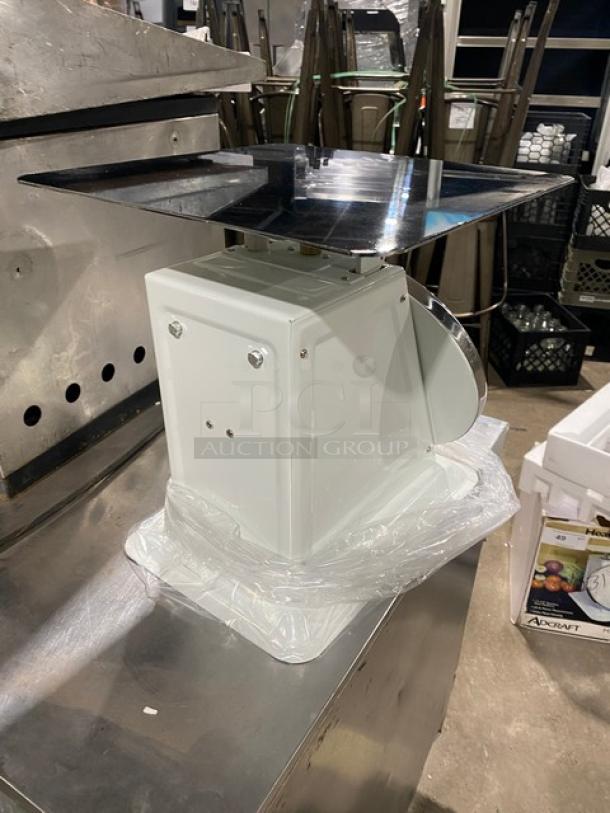 Adcraft Commercial SCA100 white dial scale, 100 lb. capacity, 13.5" stainless steel platform, new condition.