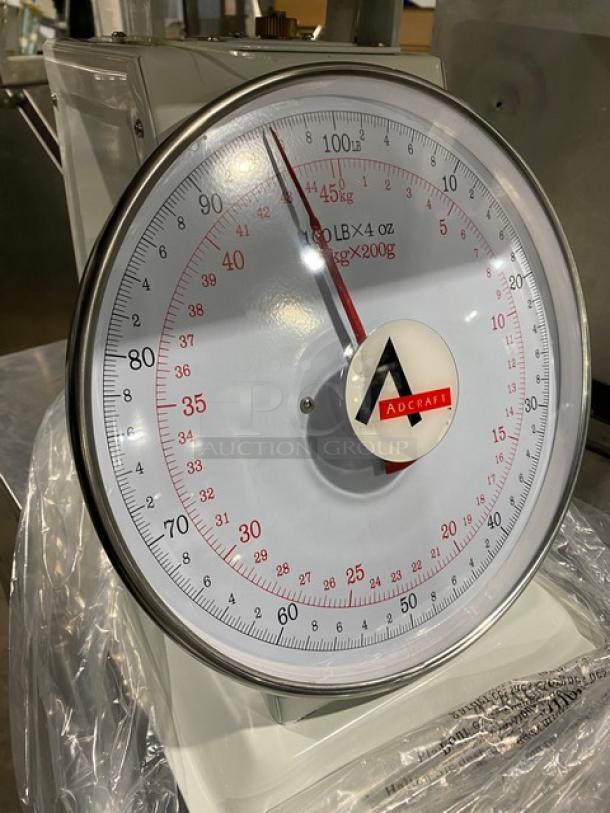 NEW Adcraft SCA100 white commercial scale, 100 lb capacity, with 13.5" stainless steel platform. Model: SCA-100.