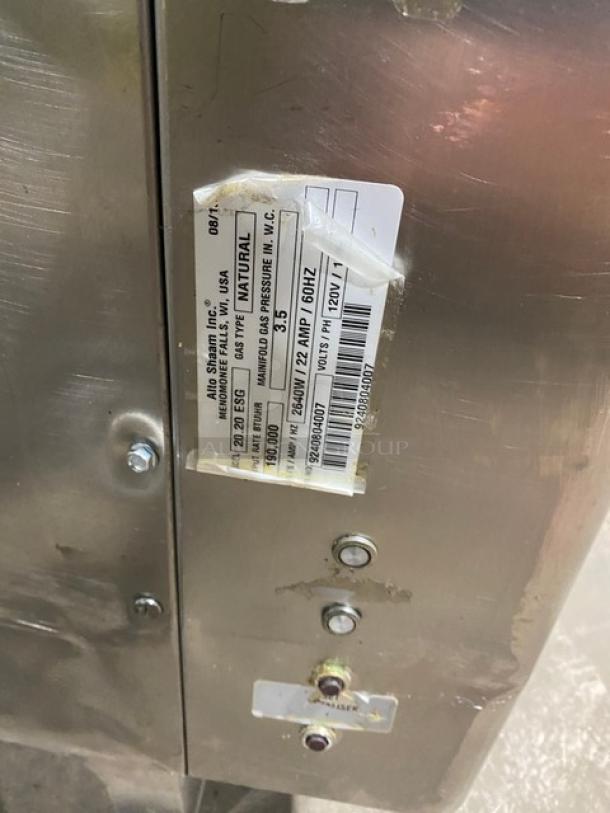 Alto-Shaam Combitherm 2020ESG combi oven with label showing model, serial number, and gas specifications. Stainless steel exterior.