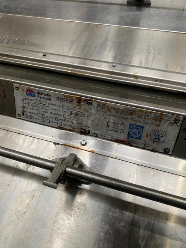 Middleby Marshall PS360S stainless steel double-stacked conveyor pizza oven, natural gas, on casters, model and serial number plate visible.