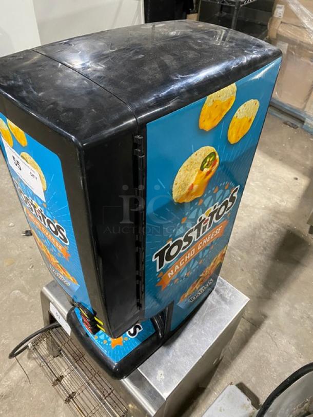 Gold Medal 5300P El Nacho Grande cheese dispenser, commercial-grade, Tostitos branding, push button, 120V, good condition.