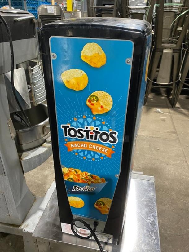 Gold Medal 5300P Tostitos Nacho Cheese Dispenser, black, electric powered, push button, 120V, Tostitos branding on front.