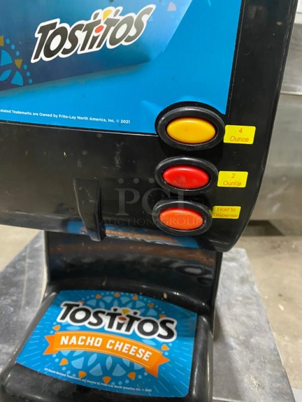 Gold Medal Model 5300P nacho cheese dispenser with push button controls, Tostitos branding, 120V. Mint condition.