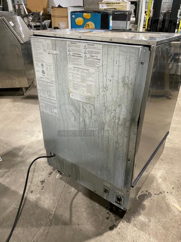 Icetro IU0220AH stainless steel air-cooled ice machine with labels, electric powered, on legs in a warehouse setting.
