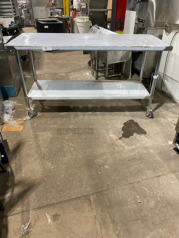 Commercial stainless steel worktop table with undershelf and casters. Durable, mobile, ideal for kitchens. Good condition.
