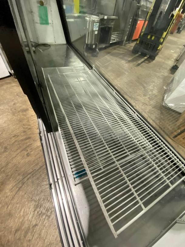 True TSID-96-3 deli merchandiser with slanted glass, rear sliding doors, poly-coated rack, 96", 115V, 1 phase, SN: 1-3647545.