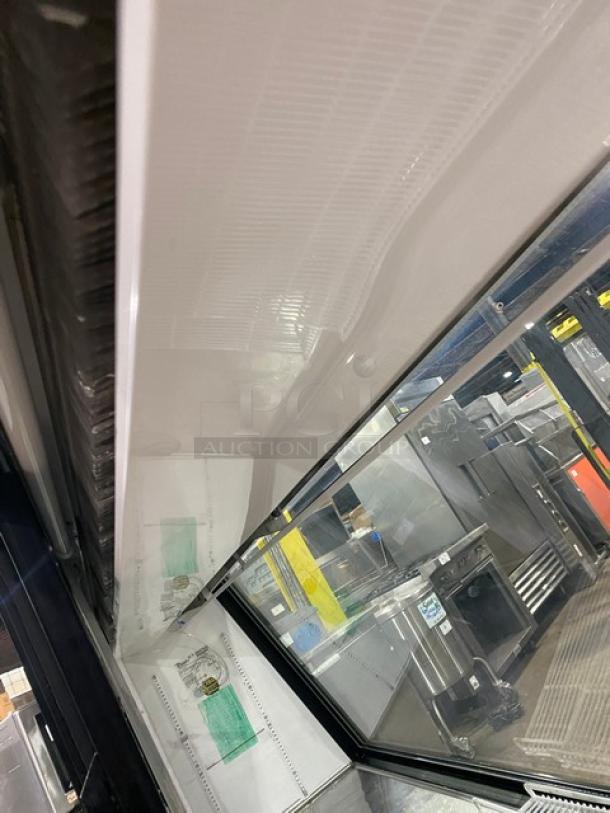 True TSID963 deli merchandiser display case, 96" slanted glass, poly-coated wired rack, rear sliding doors, 115V, SN: 1-3647545.