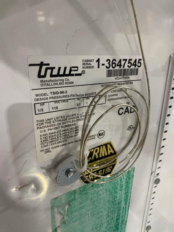 True TSID-96-3 refrigerated display case label, serial number 1-3647545, 115V, multi-tier, slanted glass, sliding doors.