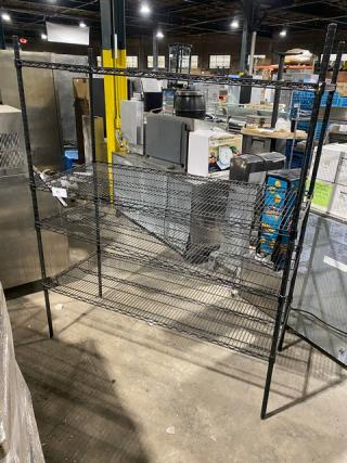 Commercial black multi-tier wire storage rack with legs. Features adjustable shelves for utility use. Excellent condition.