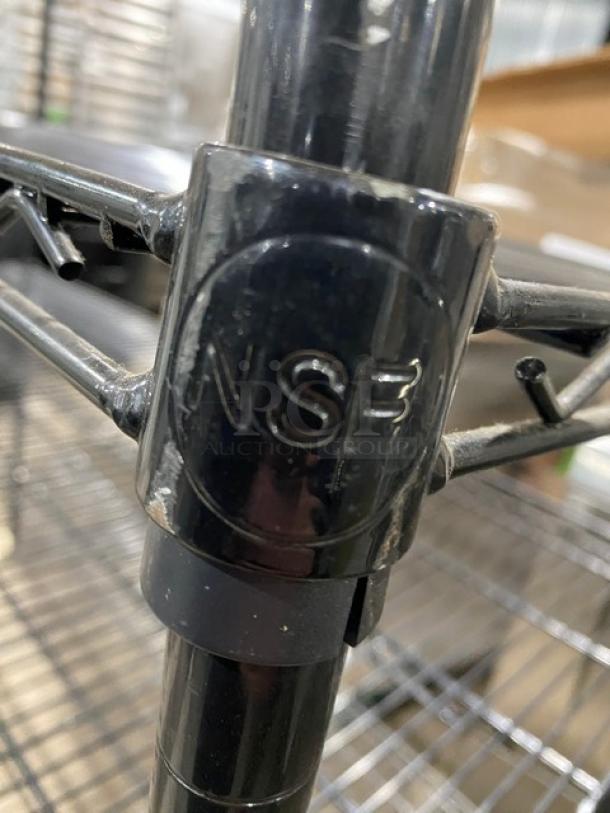 Commercial black multi-tier wired storage rack, NSF certified, featuring sturdy legs, ideal for utility shelving.