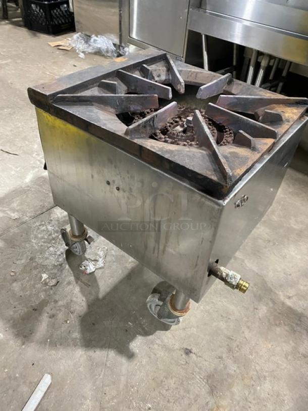 Commercial stainless steel gas-powered single burner stock pot range on casters, used condition, ideal for large-scale cooking.