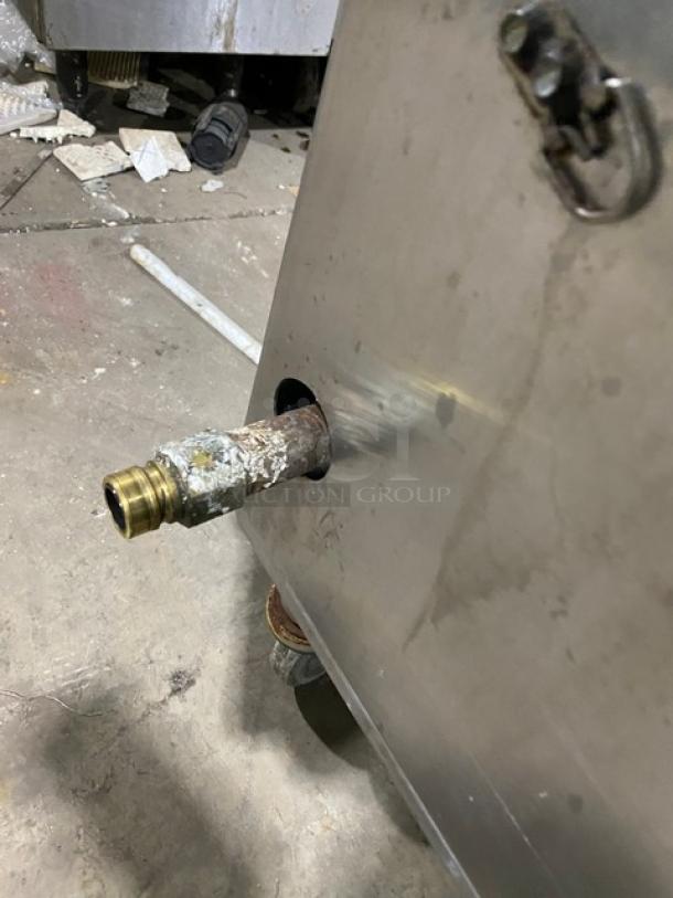 Commercial stainless steel gas-powered single burner stock pot range on casters. Visible gas connection; used condition.