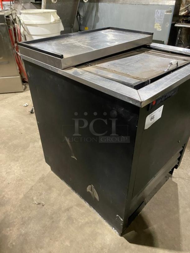 True commercial 24.5" black bottle cooler, model TD-24-07, with stainless steel sliding top, 115V, used condition.