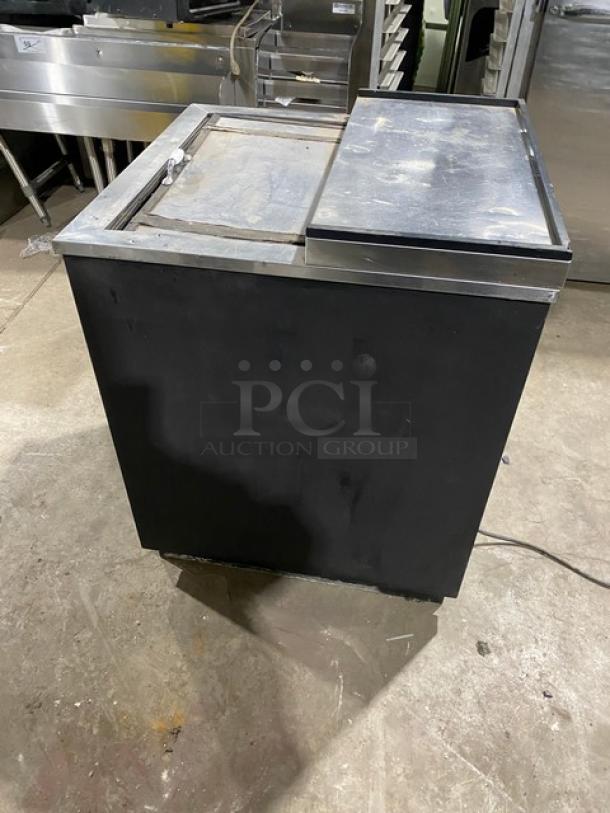True TD-24-07 commercial bottle cooler, black with stainless steel sliding lid, 24.5", 115V, good condition.