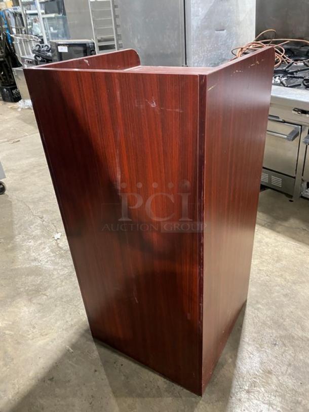 Commercial wooden trash receptacle cabinet with "Thank You" style design. Rich wood finish, enclosed structure, used condition.