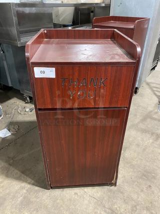 Commercial wooden waste receptacle cabinet with "Thank You" engraving, dark finish, enclosed design, visible tag marked "69".