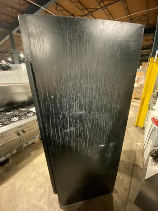 Beverage-Air MT27 black single glass door merchandiser refrigerator, poly-coated rack, 115V, used condition.