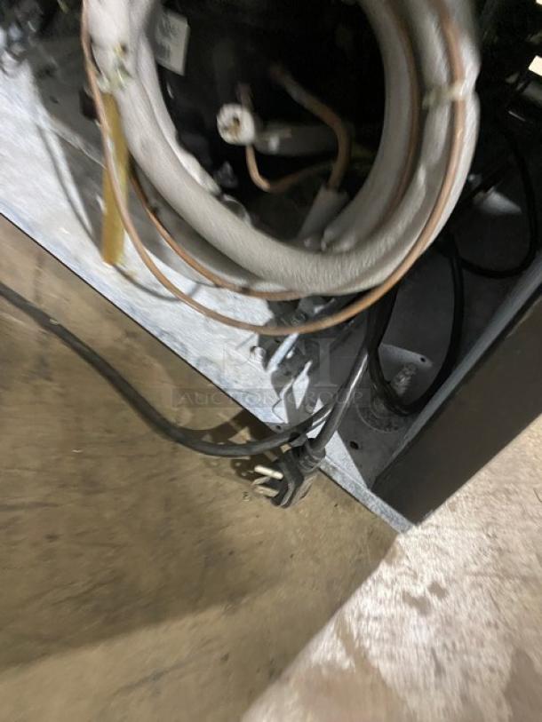 Beverage-Air MT27 commercial refrigerator components, showing wiring and interior condition. Model label visible, 115V, 1 Phase.