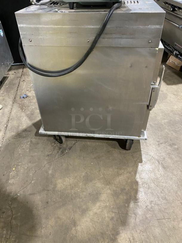 Henny Penny HC-900 stainless steel insulated heated holding cabinet, half-height, on casters, electric powered.