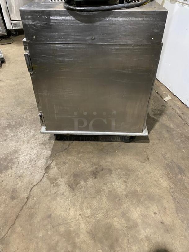 Henny Penny HC-900 stainless steel commercial heated holding cabinet, electric-powered, half-height, on casters.