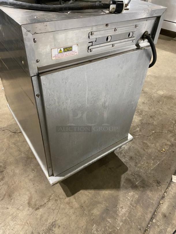 Henny Penny HC900 commercial stainless steel heated holding cabinet, electric powered, half-height, on casters, with caution label.