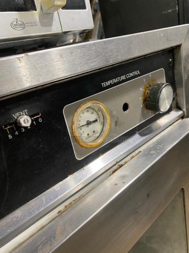 Henny Penny HC-900 heated holding cabinet, stainless steel, temperature control dial, vent settings visible.
