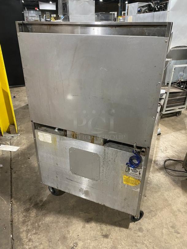 Southbend X336D stainless steel 6-burner range/oven combo with salamander shelf, backsplash, and casters; SN: 99H68143.