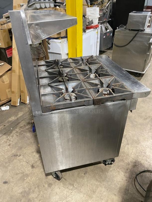 Southbend X336D stainless steel 6-burner range/oven combo with backsplash, overhead salamander shelf, and wired oven rack on casters.