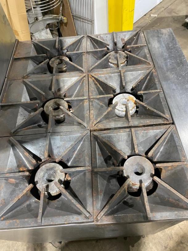 Southbend X336D 6-burner stainless steel range/oven combo with backsplash, overhead salamander shelf, and casters. Moderate wear.