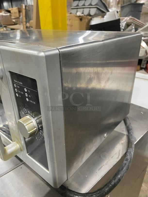 Amana Commercial stainless steel microwave oven, model RMS10DS, in good condition. Features 120V, 1 phase, countertop design.