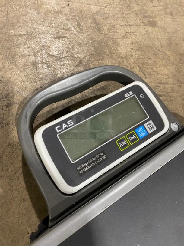 CAS Model PB commercial bench scale, electric powered, 150/300 lb capacity, visible control panel with buttons, mounted on legs.