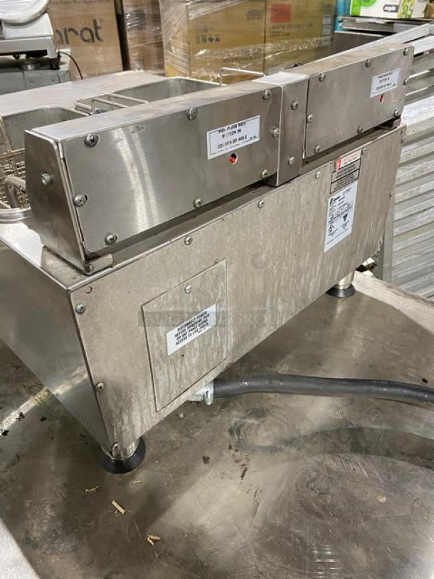 APW Wyott HEF30Ti stainless steel electric countertop deep fryer, includes fry basket, on legs, 208/240V, labels visible.