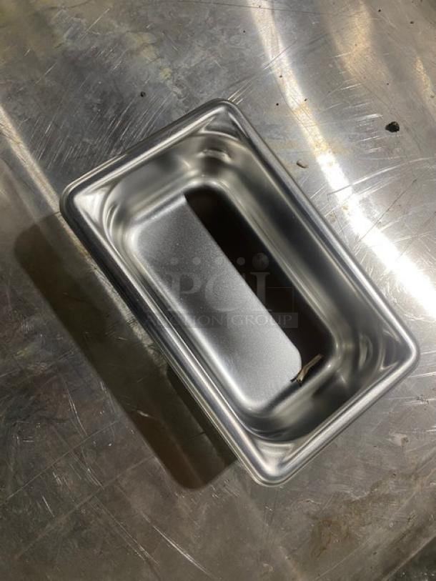 Vollrath Super Pan-V stainless steel 1/9-size, 2" deep anti-jam pan, model 30922, shown new on a metal surface.